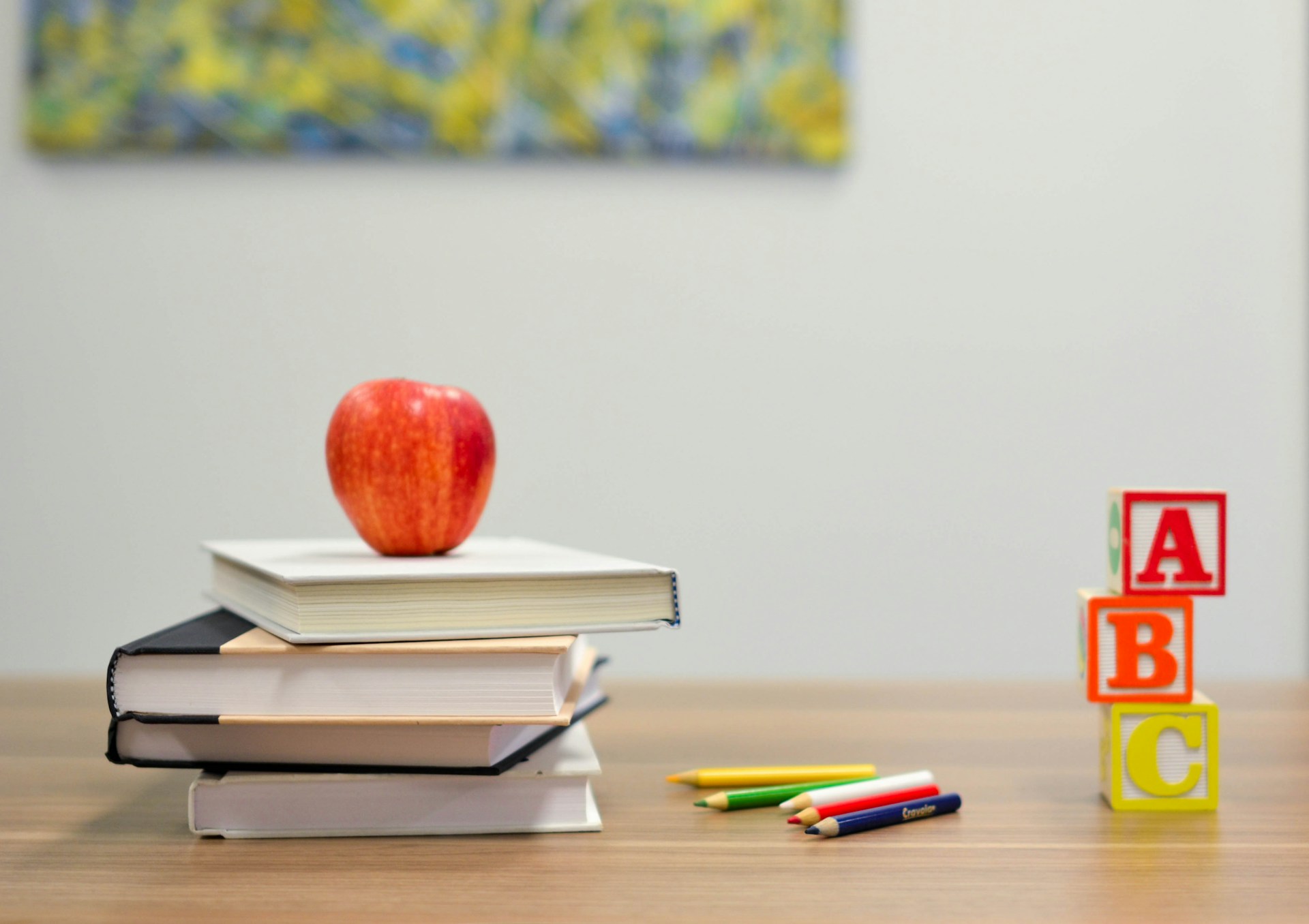 red apple on desk